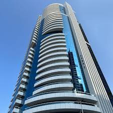 Low angle view of Saba Tower 1. Expert real estate agent guidance for luxury apartment investments in Dubai.
