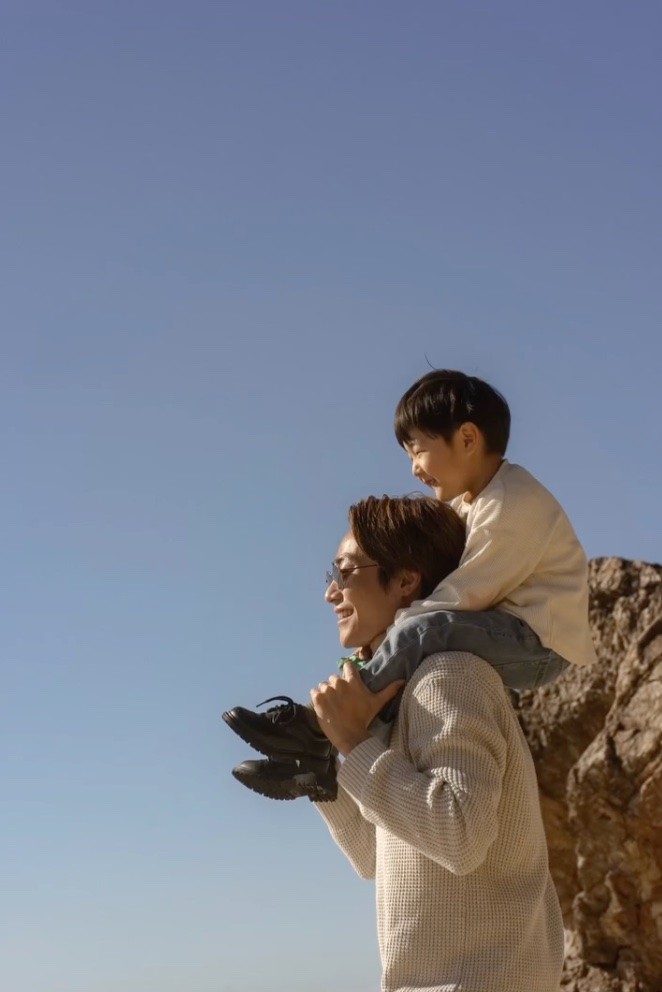 Father & son enjoying the beach