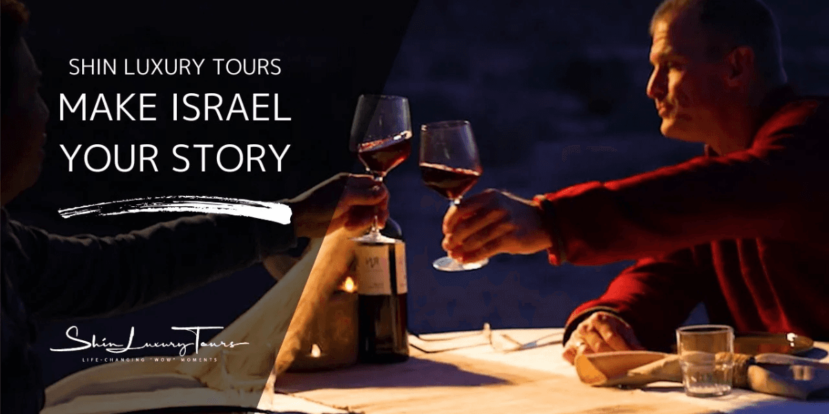 Two people toasting with wine glasses at a luxury dinner, representing Shin Luxury Tours' immersive experiences.