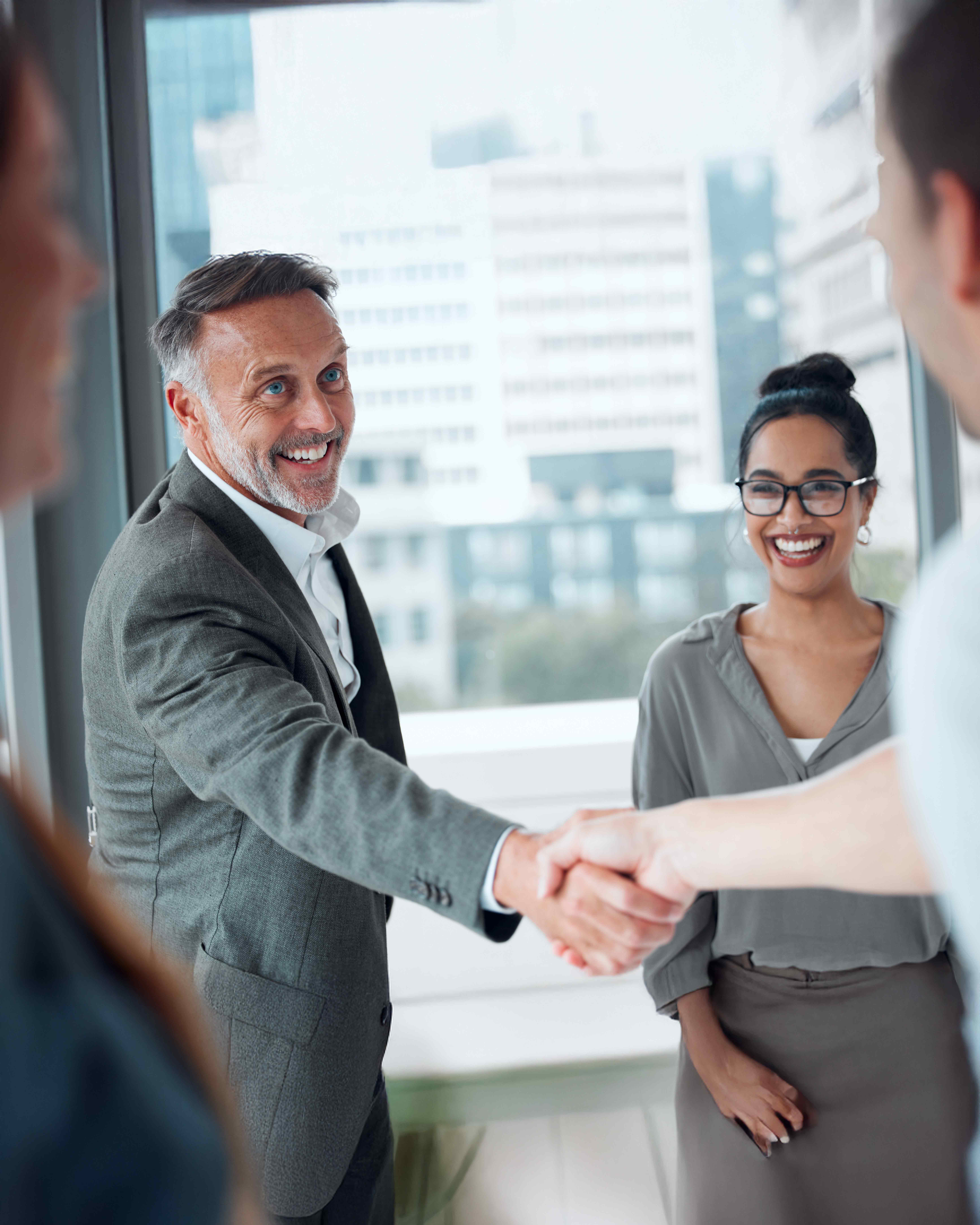Two business person shaking hands