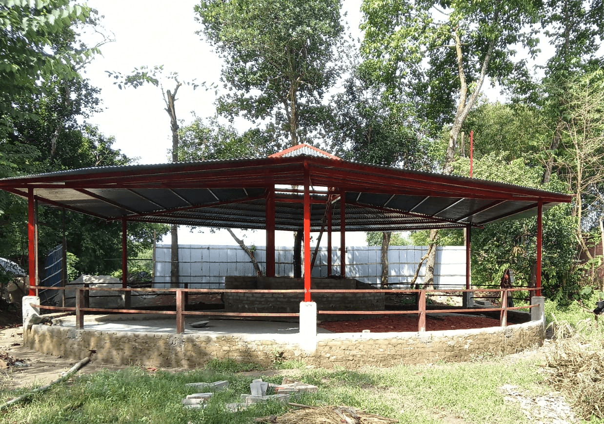 group of women in red and white dress standing on brown wooden bar during daytime