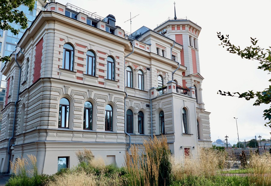 a building with trees and plants