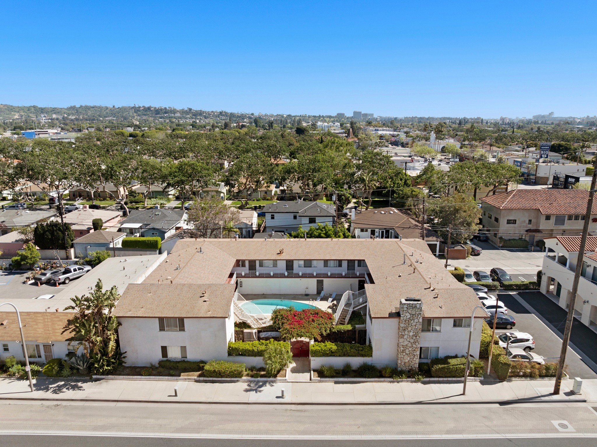 Wide aerial showcasing full property layout and surrounding neighborhood at 11178 Culver Blvd.