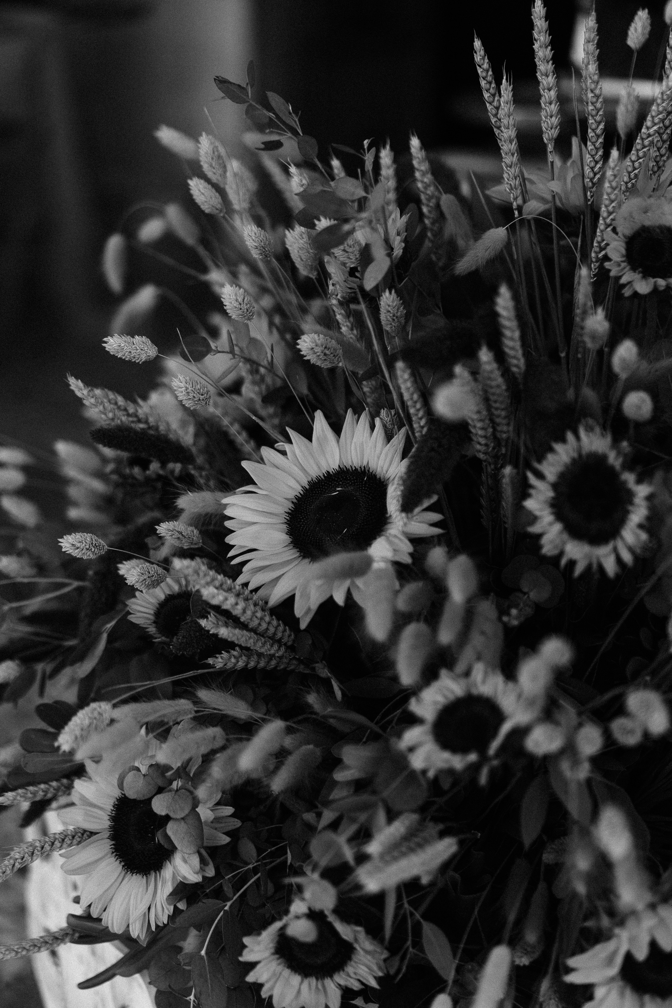 Close-up of a rustic bespoke floral arrangement featuring sunflowers for a country-style Greek wedding