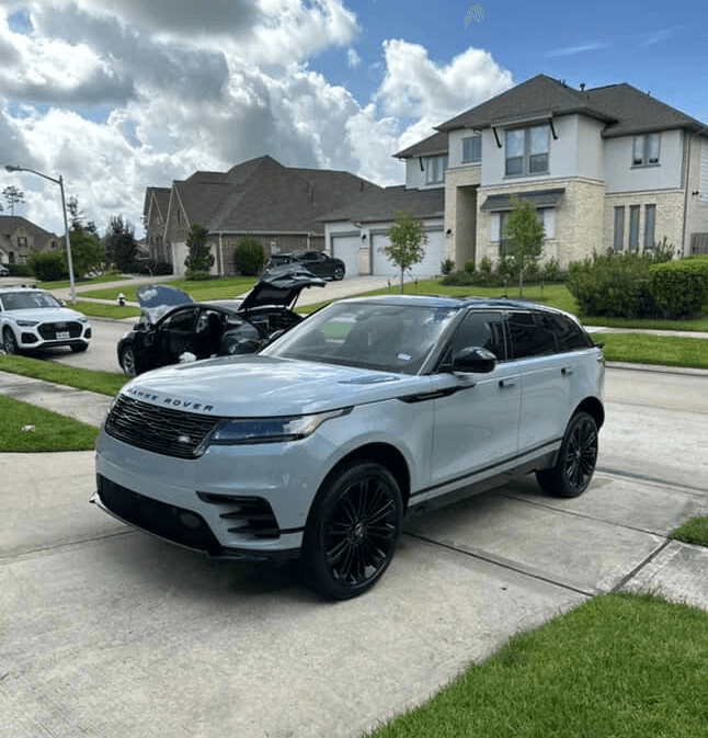 Light grey Range Rover Velar with black rims after a full exterior detail and wax in Houston.