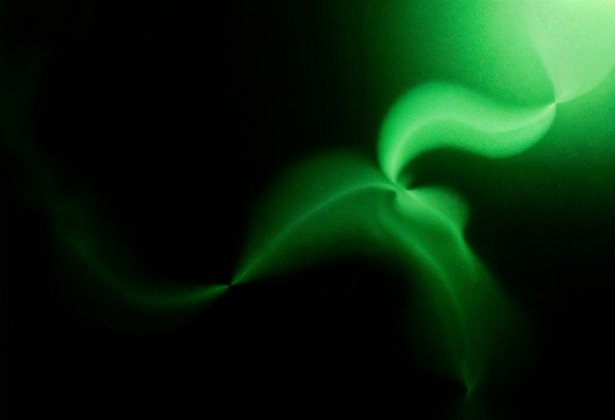 Abstract green light trails on dark background