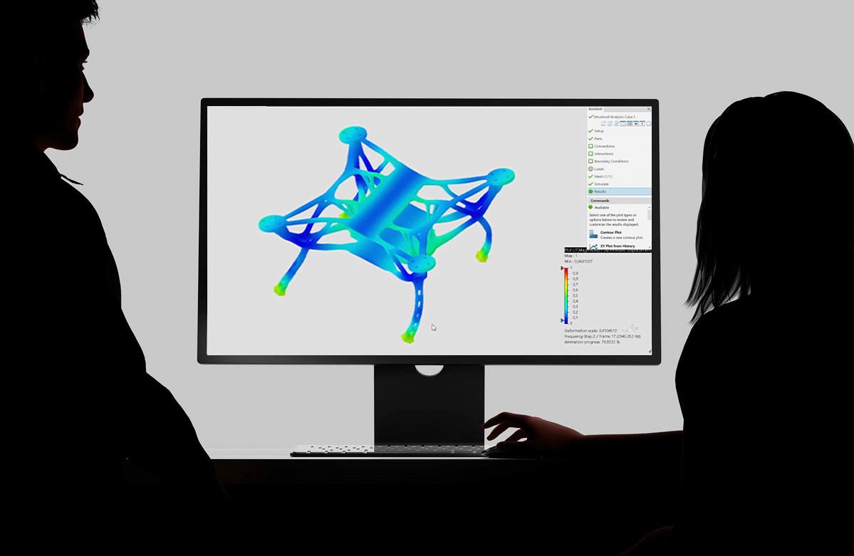 Black and white image of people working at a table with laptops, showing hands gesturing during discussion of digital content displayed on screens, with fabrica® logo in the corner.