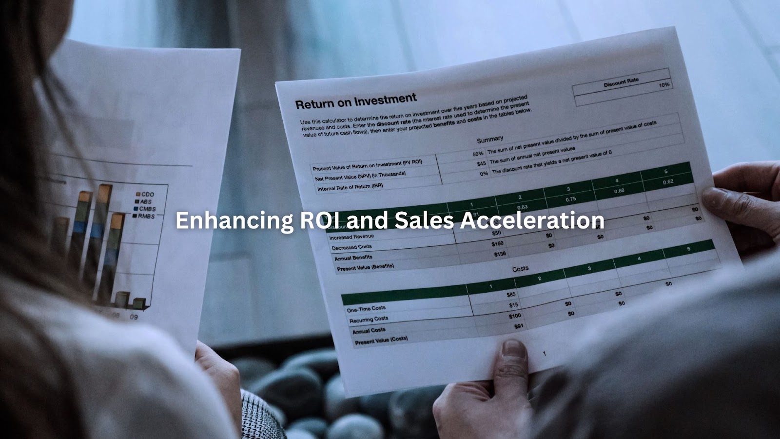 Close-up of two people analyzing printed ROI reports and bar charts.