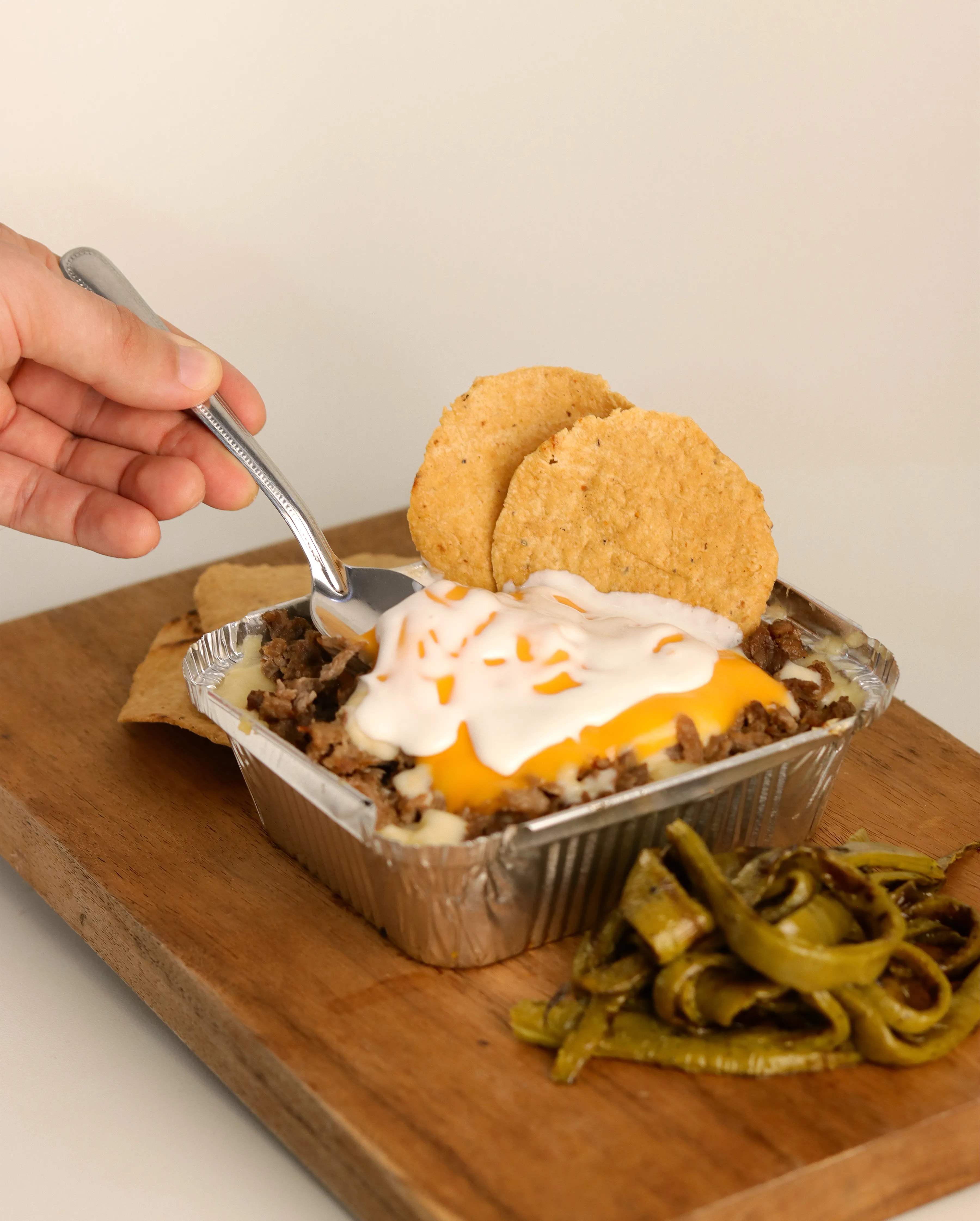 Orden de papas al horno con carne y queso.
