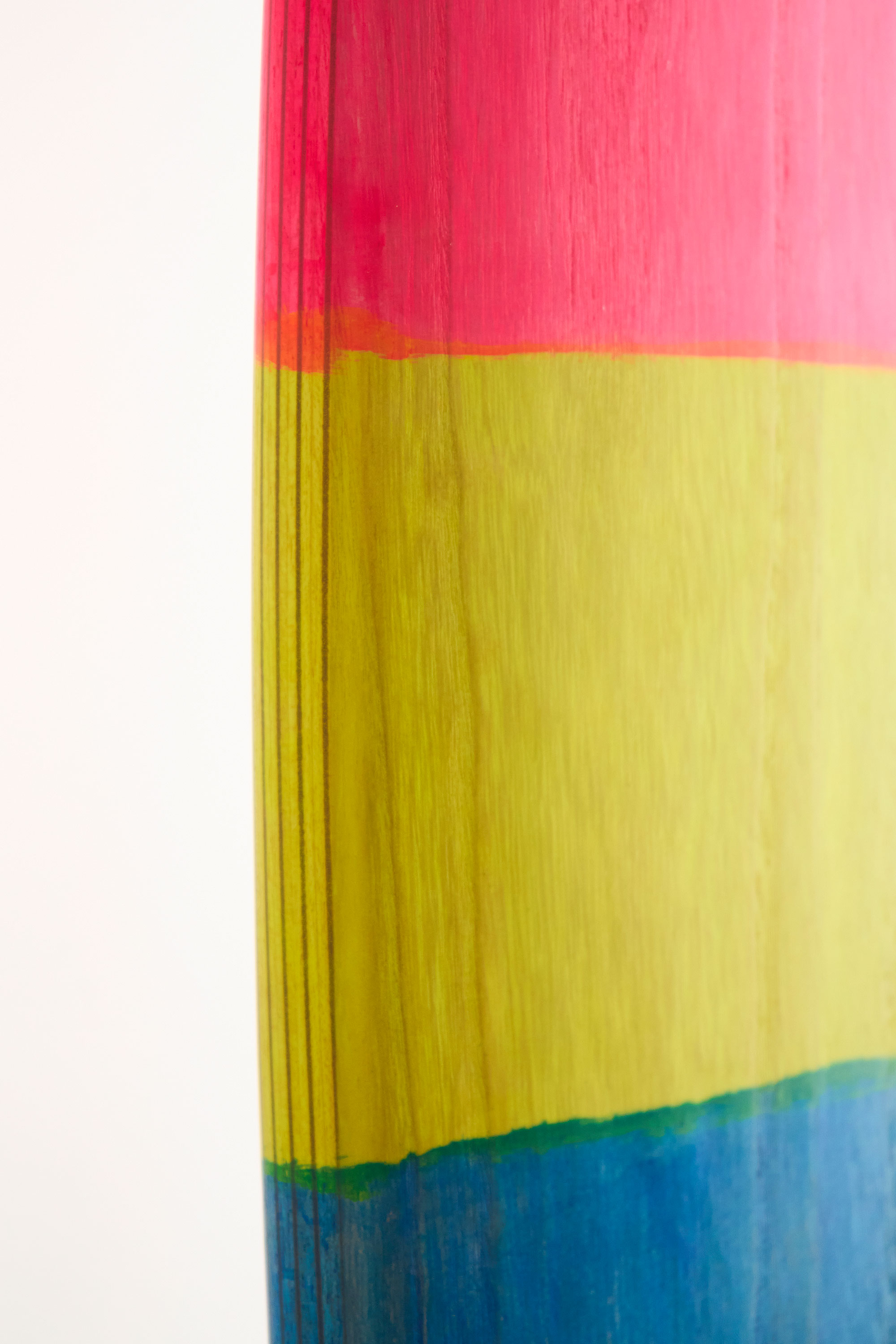 Timber surfboard rail with painted stripes