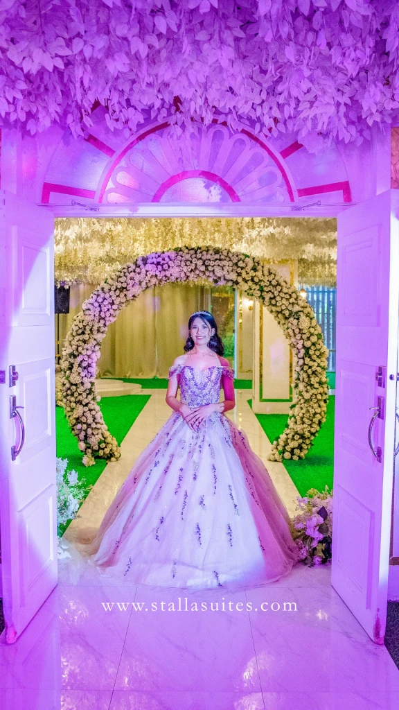 Debutante under the violet-lit arch at Celestia Hall, Stalla Suites QC
