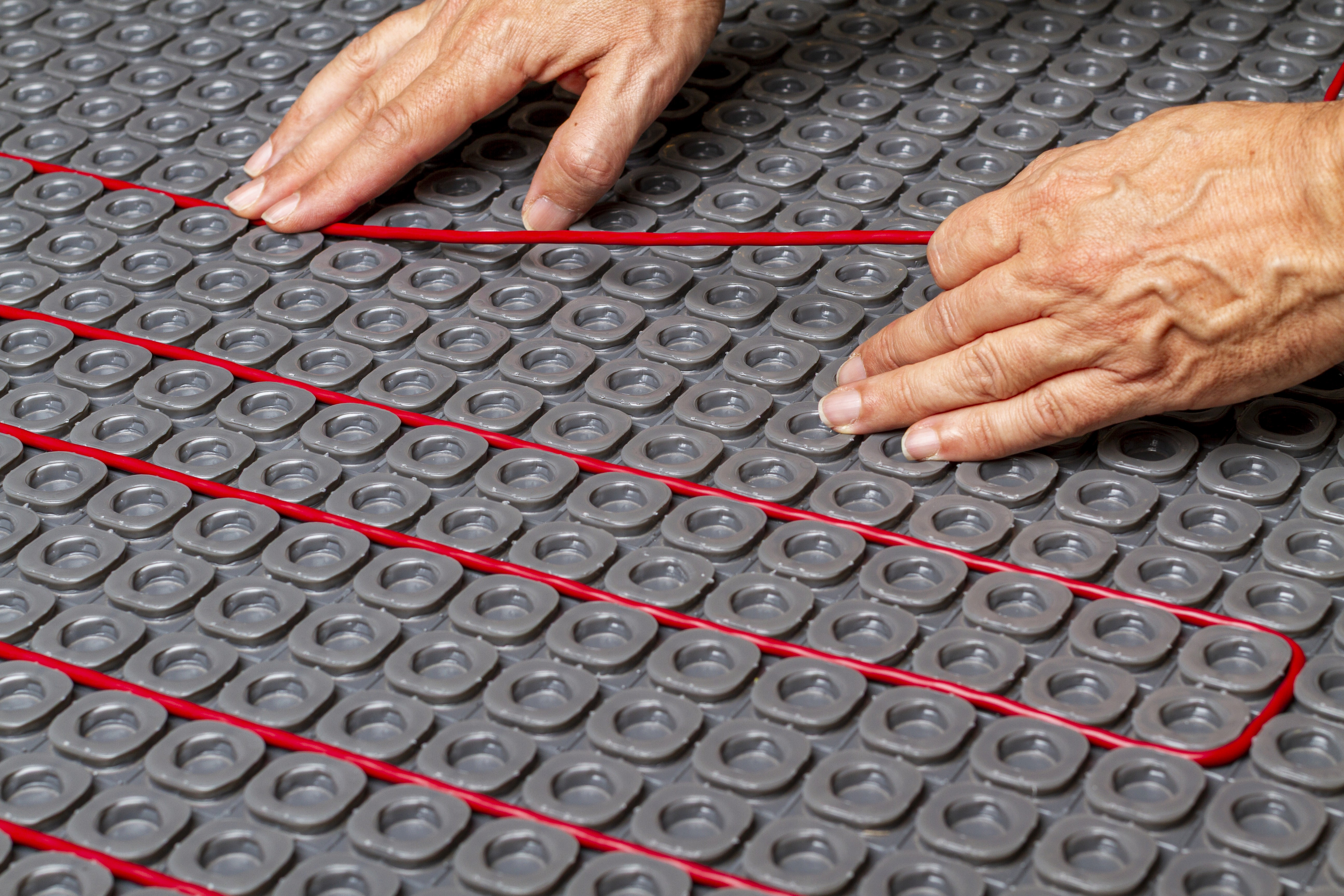 Nuheat electric floor heating systems compatible with tile stone and engineered flooring surfaces in BC residential projects