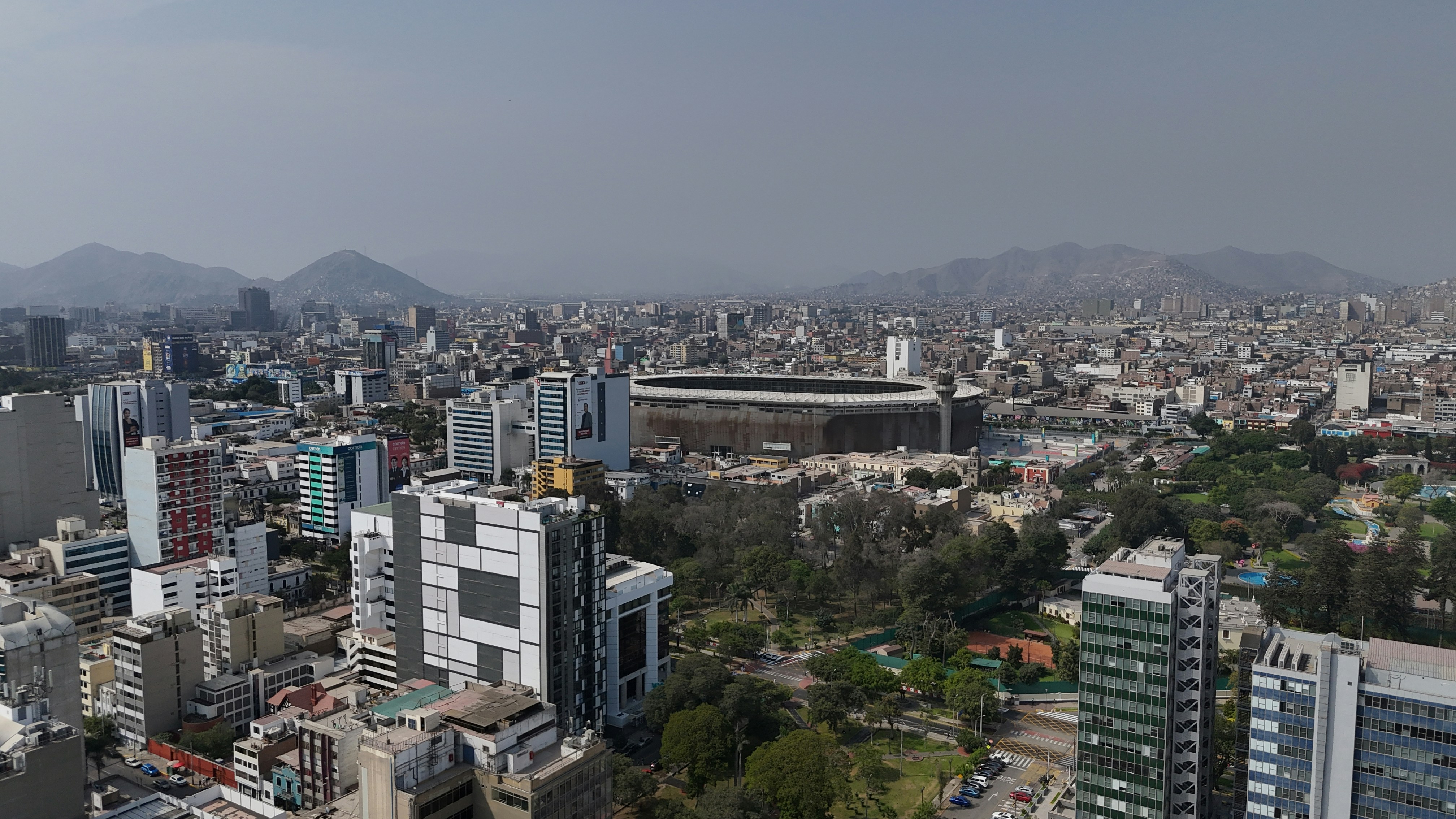 An aerial view of a city with tall buildings