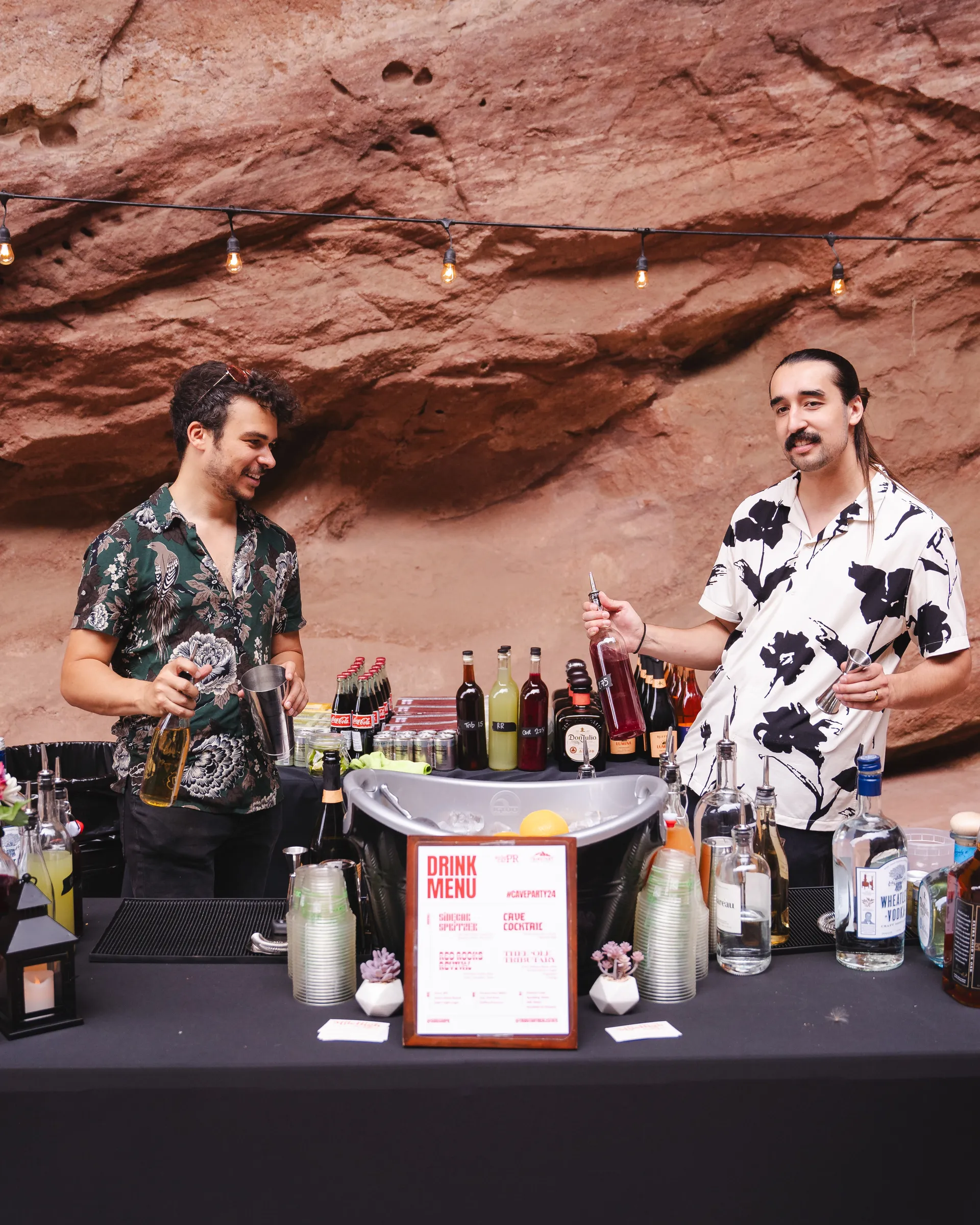 Josh & Kalani dancing behind a bar