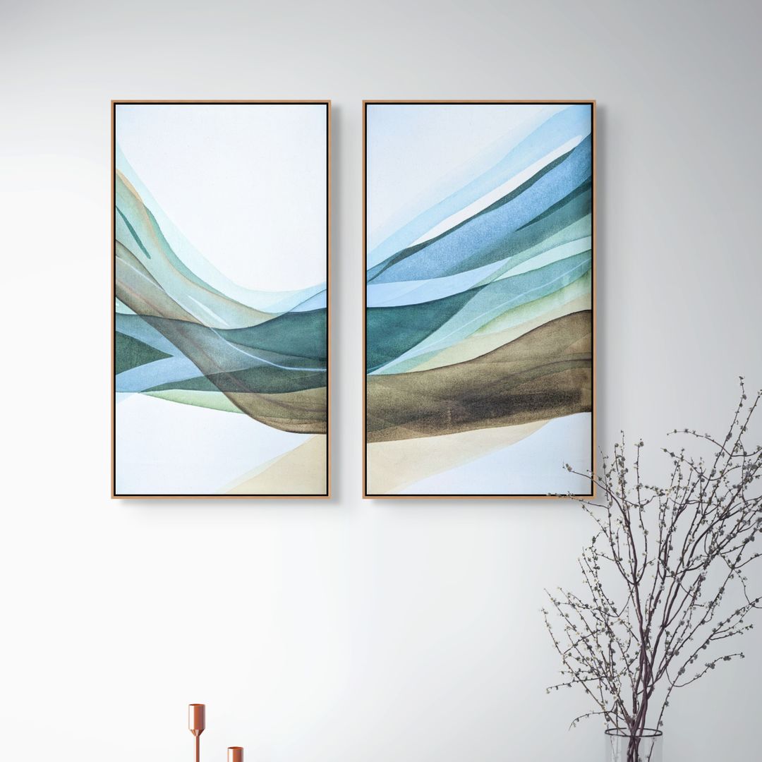Abstract artwork featuring two framed pieces with wavy lines in shades of blue, green, and beige on a white wall.