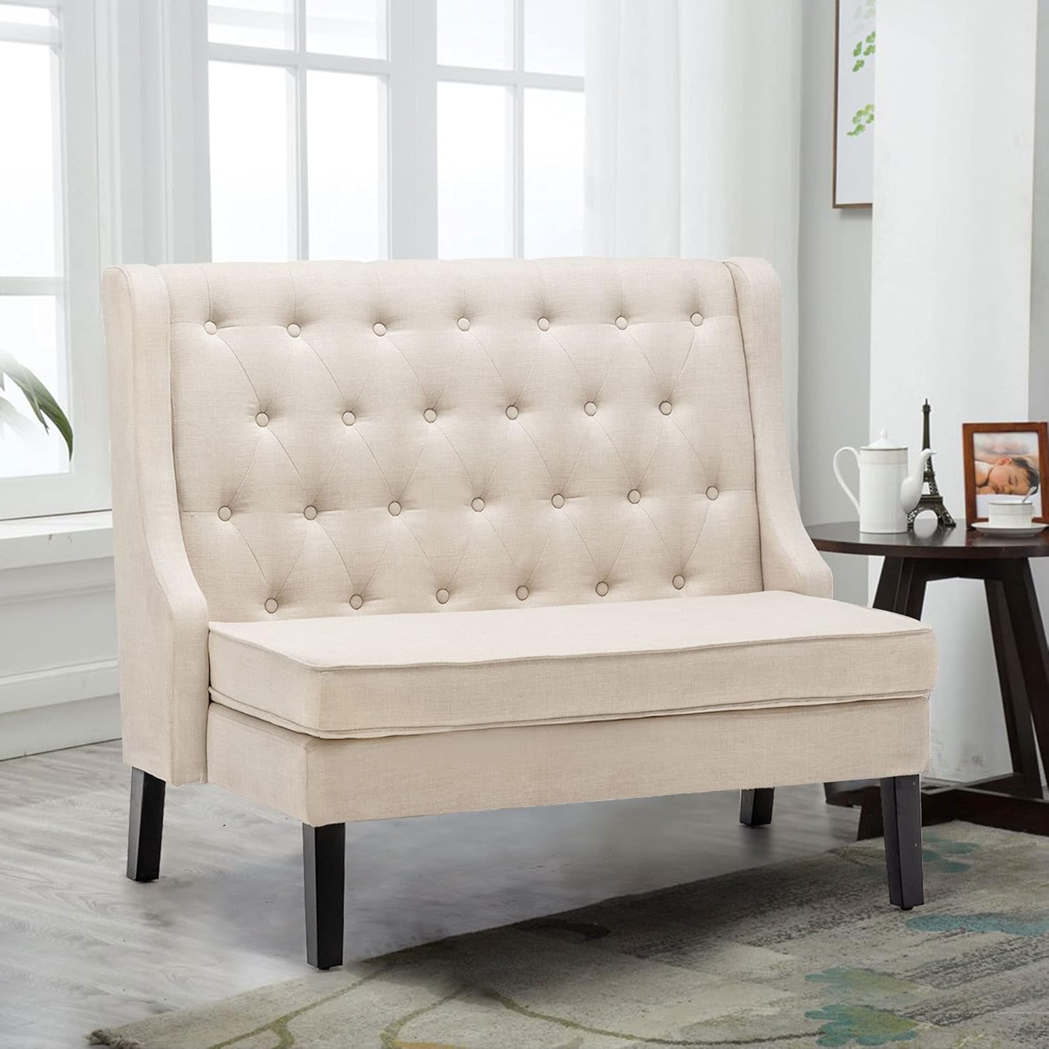 Elegant settee couch with a classic design and plush upholstery, perfect for adding sophistication to any space.