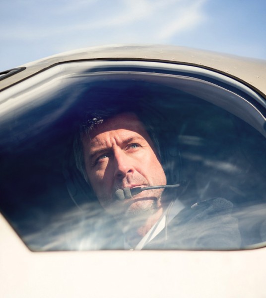 Pilatus pilot looking outside the cockpit window