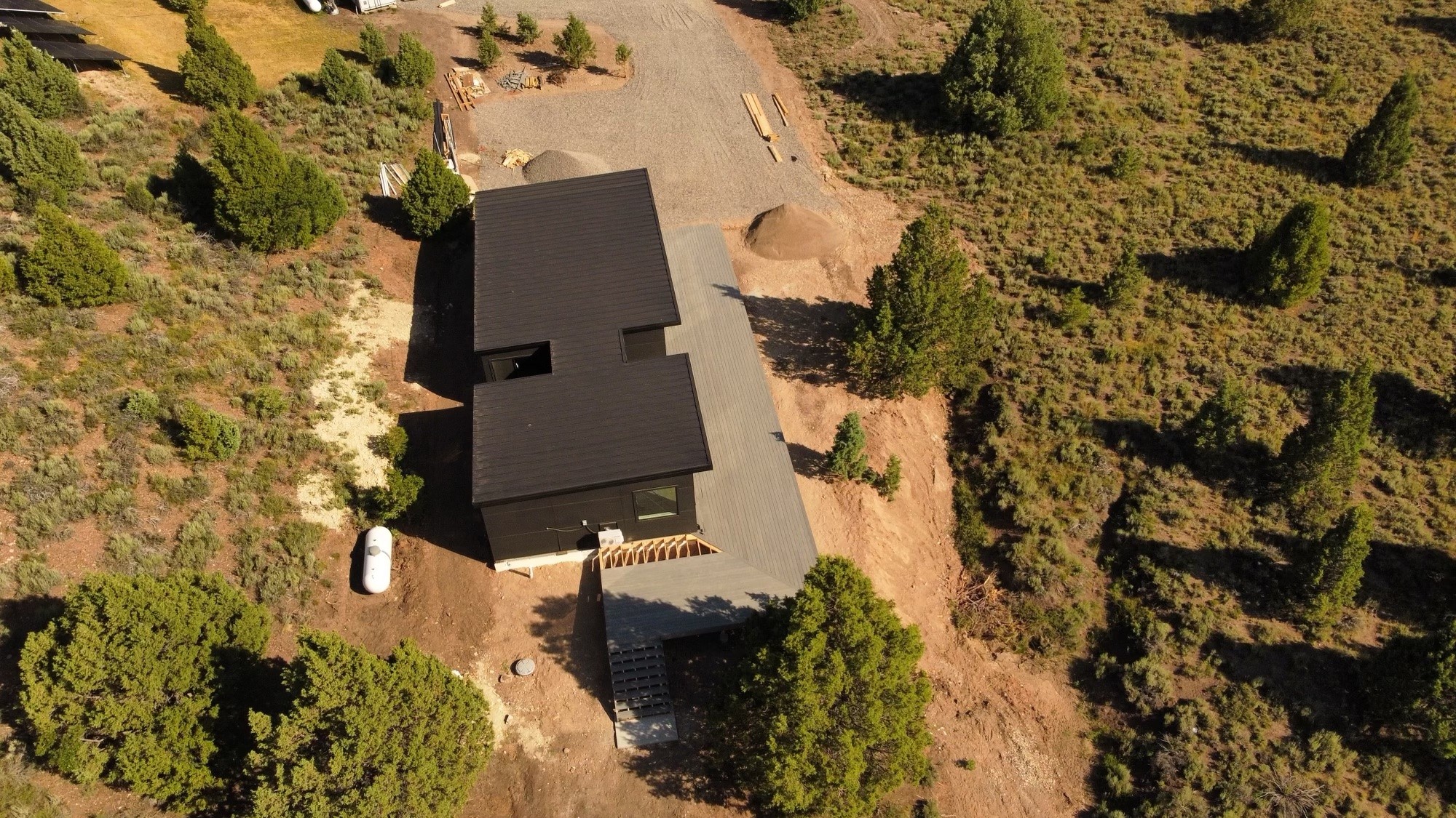 Aerial view of a large modular home in a semi arid region.