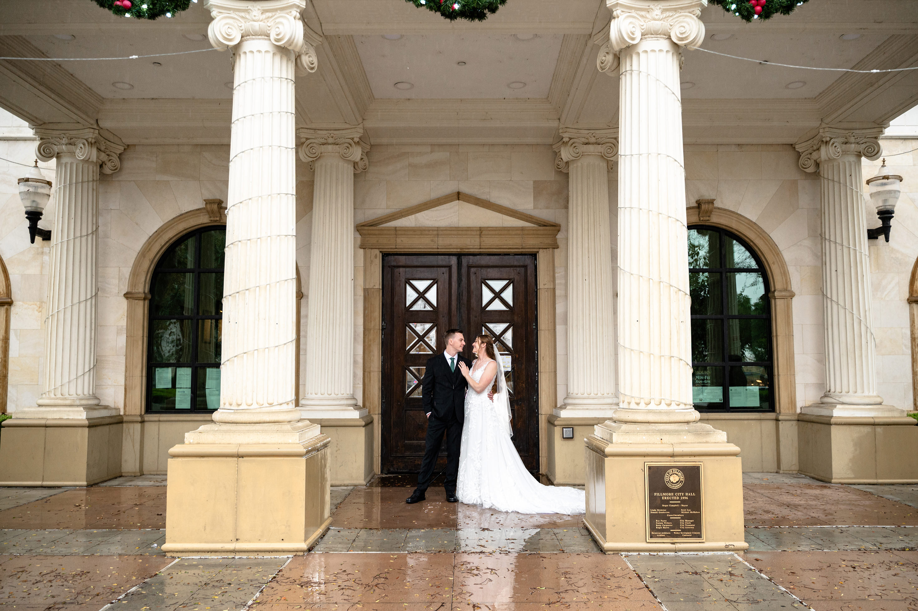 Flat lay wedding details with bouquet, rings, and sparkling bridal heels