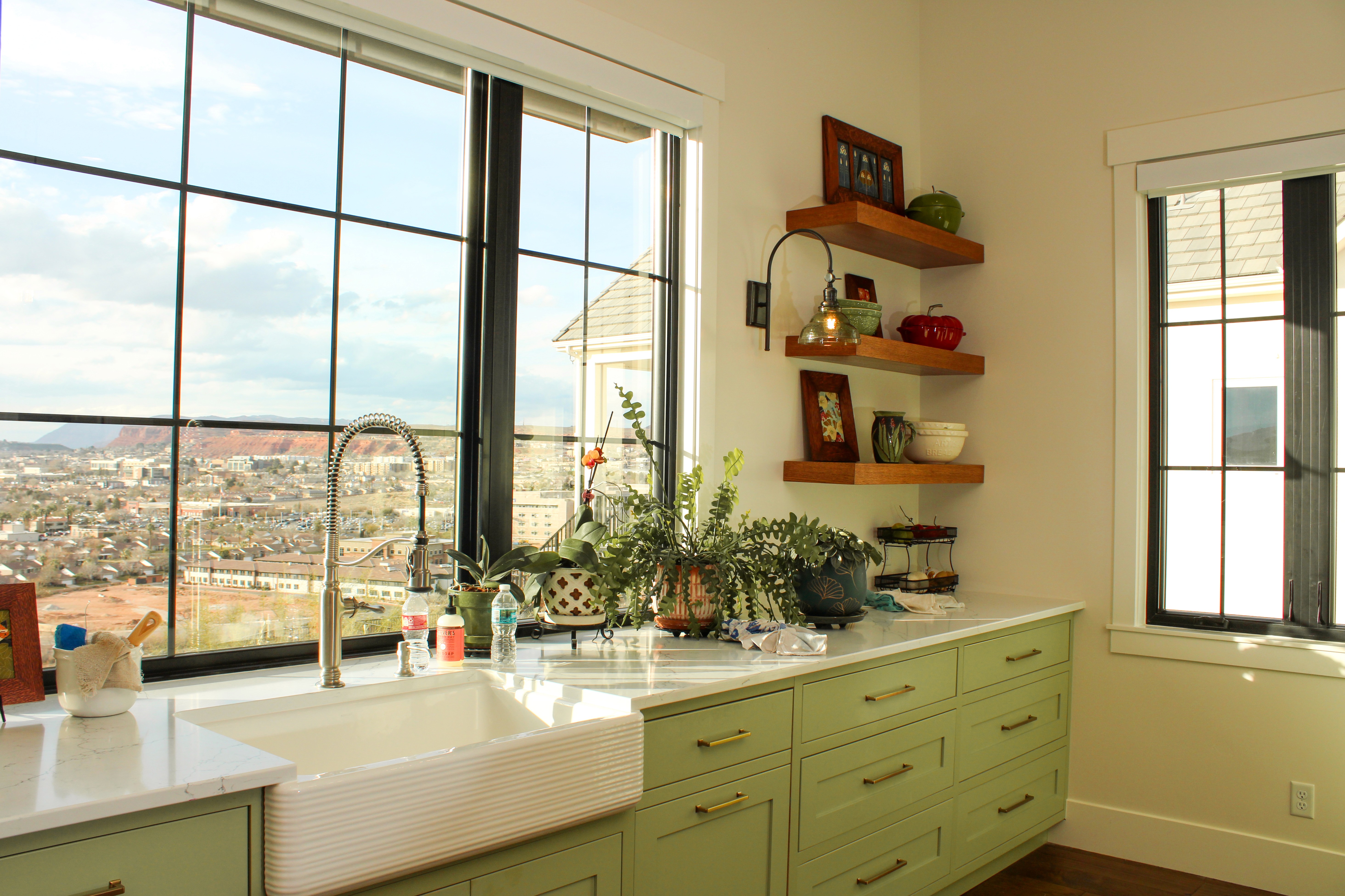 Kitchen sink in front of large gridded window overlooking St. George Utah valley in a Madsen Homes remodel