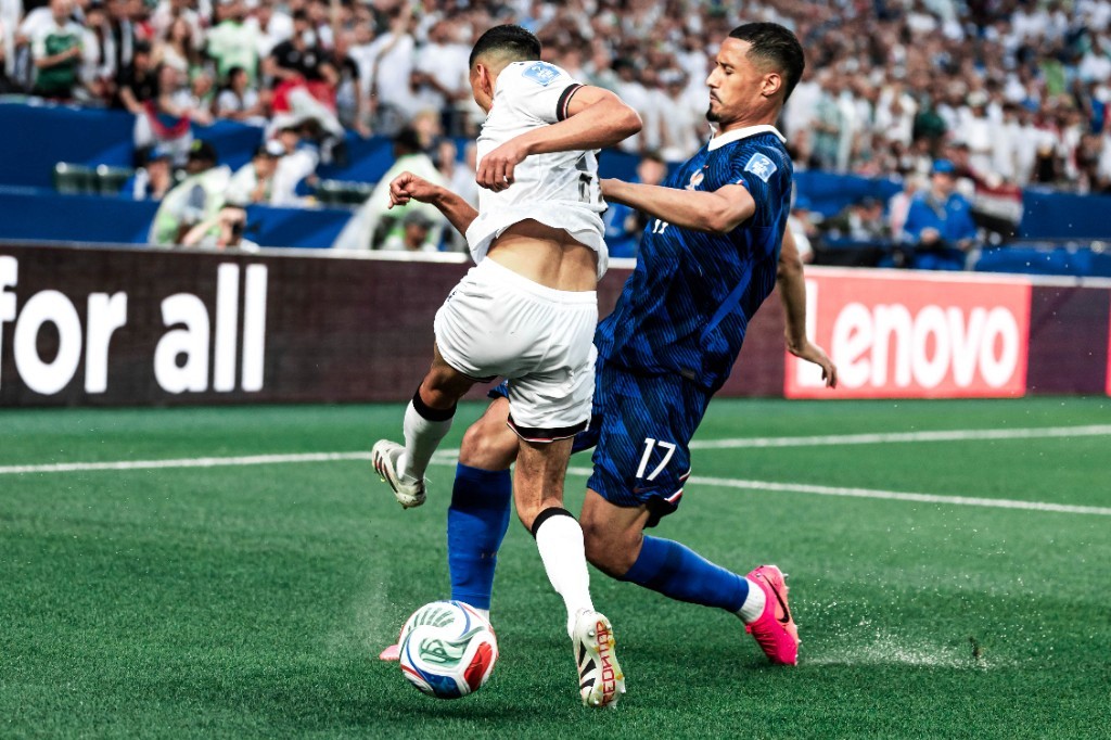 William Saliba challenges an Iraq player for the ball during France's 2026 World Cup group-stage win