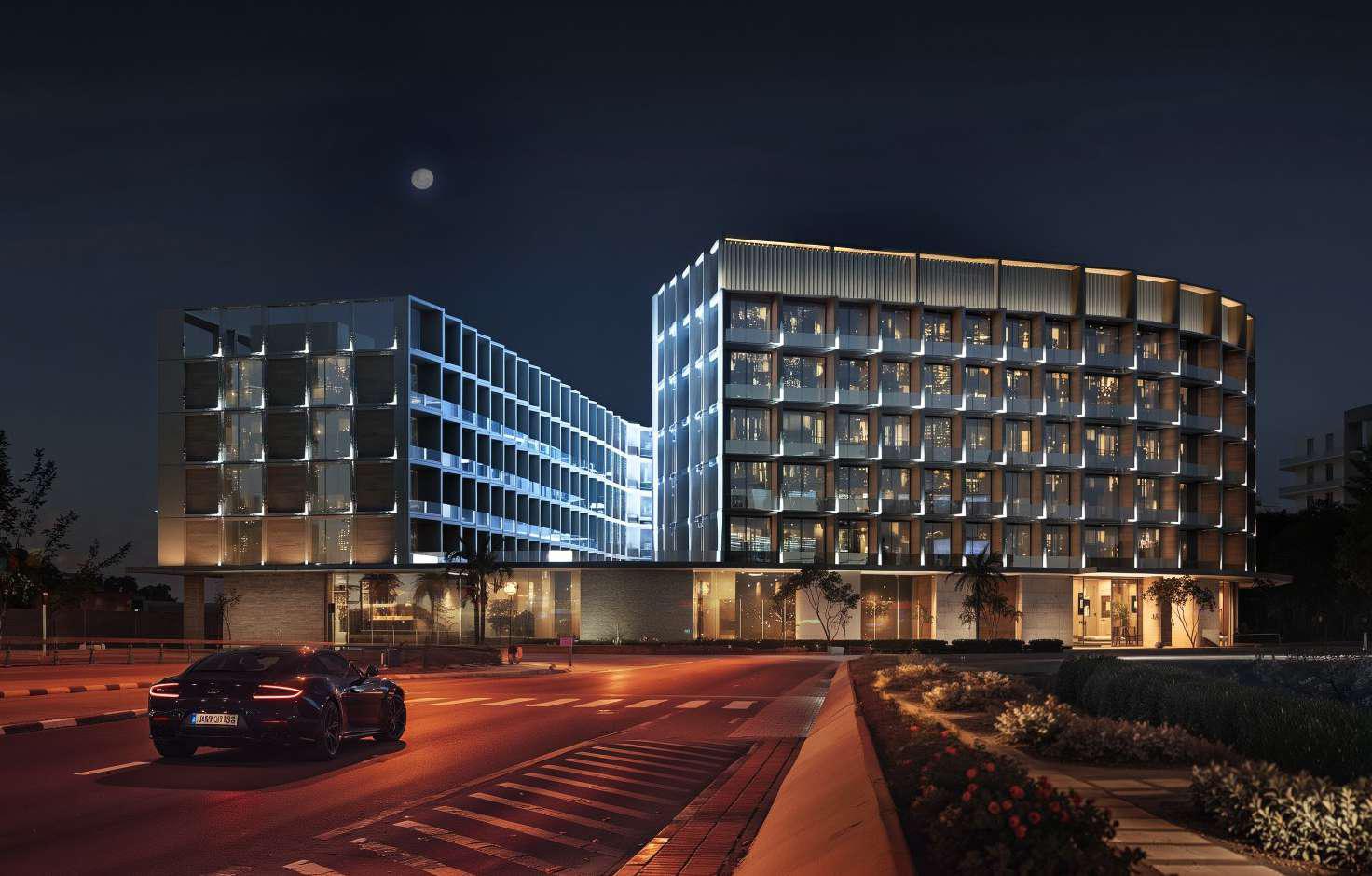 Modern facade of Binghatti Hillcrest at night. Professional real estate guidance for high-end investments.