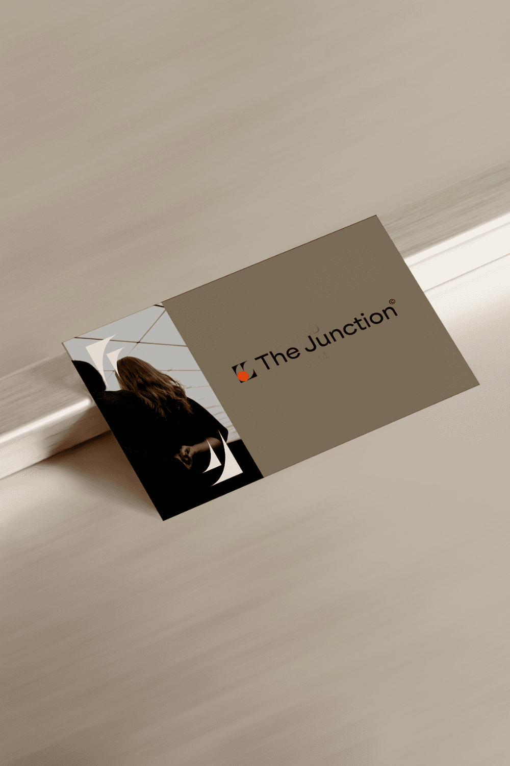 Black patent leather shoes and wide-leg pants stand on a deep red carpet, conveying a sense of elegance and sophistication.