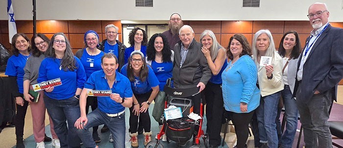From left, front and center, speaker Josh Levs, kneeling, and Amidah co-founder Laura Weisblatt. Second row is from left, Jody Ferrence, Heather Rockwood, Simi Leifer Fish, Susannah Levin, Michael Kohn, Albany Common Council Member Deborah Zamer, Dee Levy, Ephraim Sherman, Event Sponsor Herm Ungerman, Michelle Sanders, Laurie Sasson, Susan Ungerman, JFS CEO Jane Ginsburg, and JCC CEO David Posner.