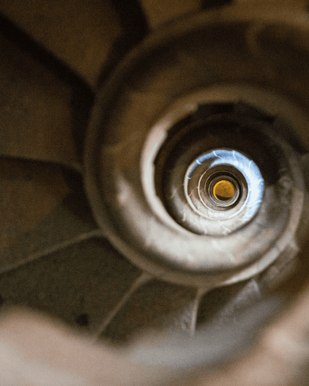 Spiral staircase inside the Sagrada Família viewed from above.