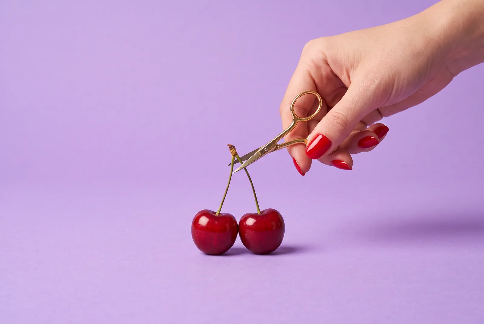 A cherry pair with one stem snipped by tiny gold scissors on a lilac backdrop, showing why a husband liking thirst traps can hurt