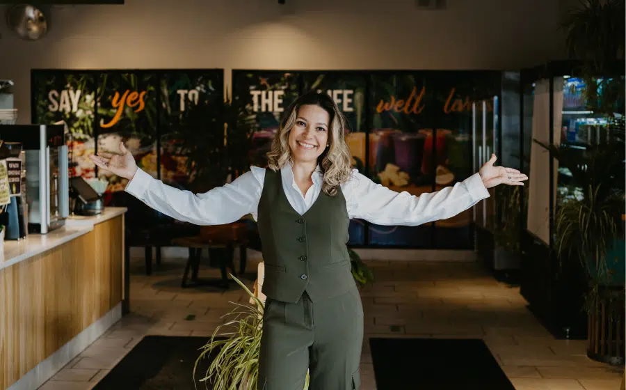 Marcieli Pastorio (seated) with team members at the Norwood, Mass. Maha Juice Bar location.