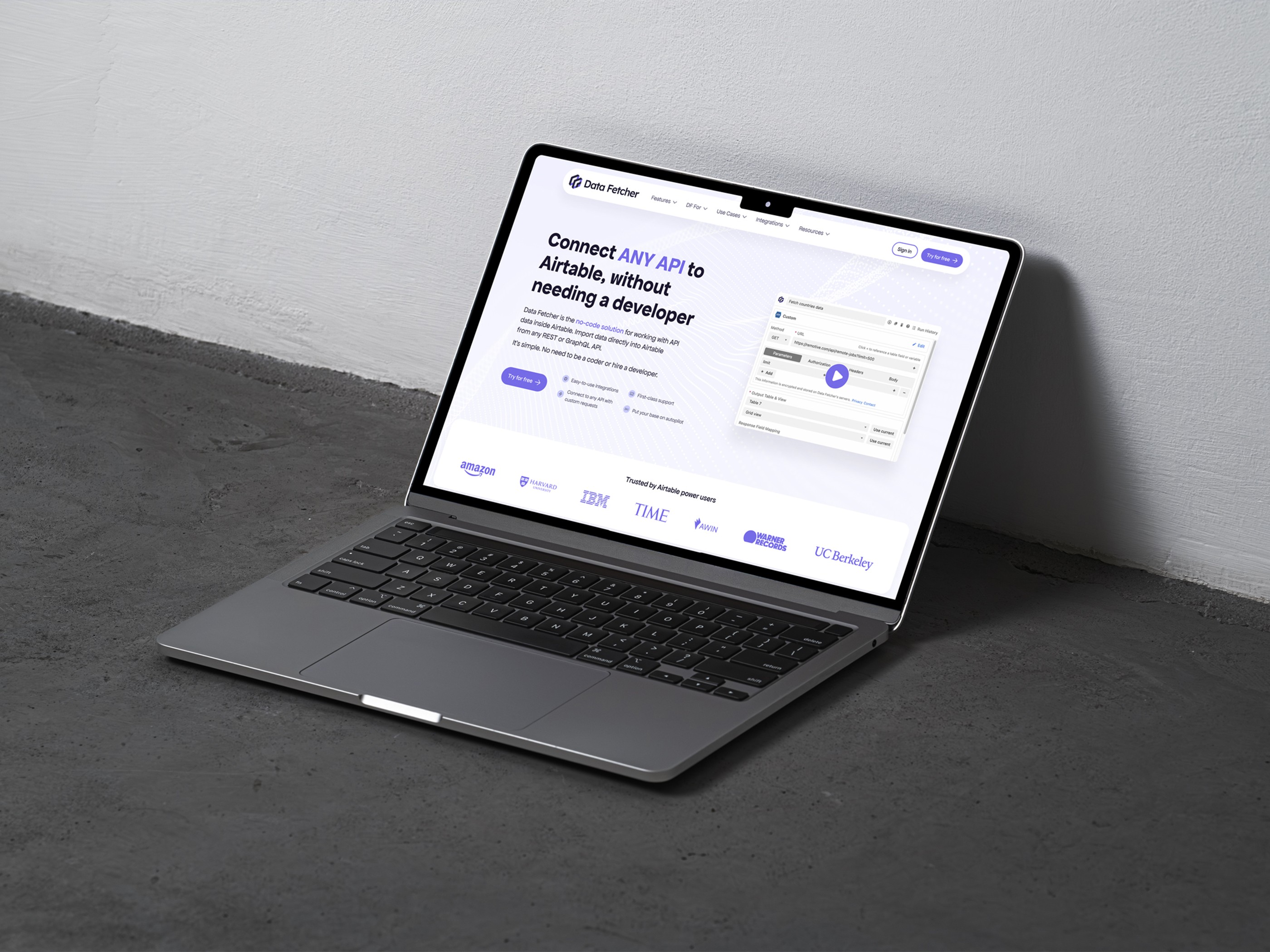 Laptop displaying a homepage design for data automation tool Data Fetcher