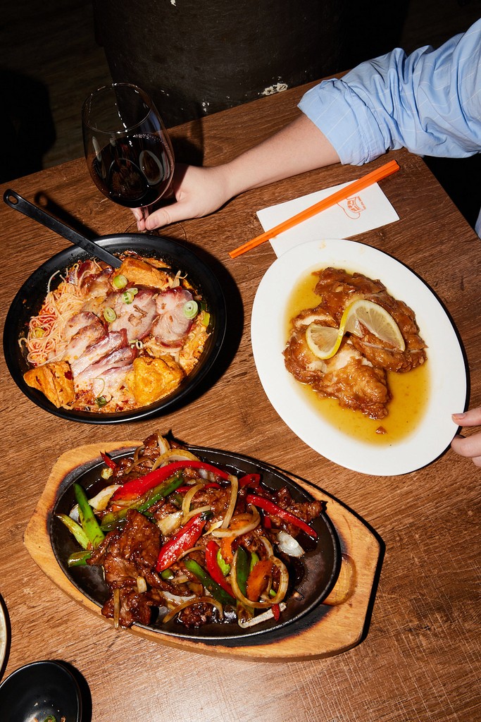 two glass of iced tea with some orange fruit around them