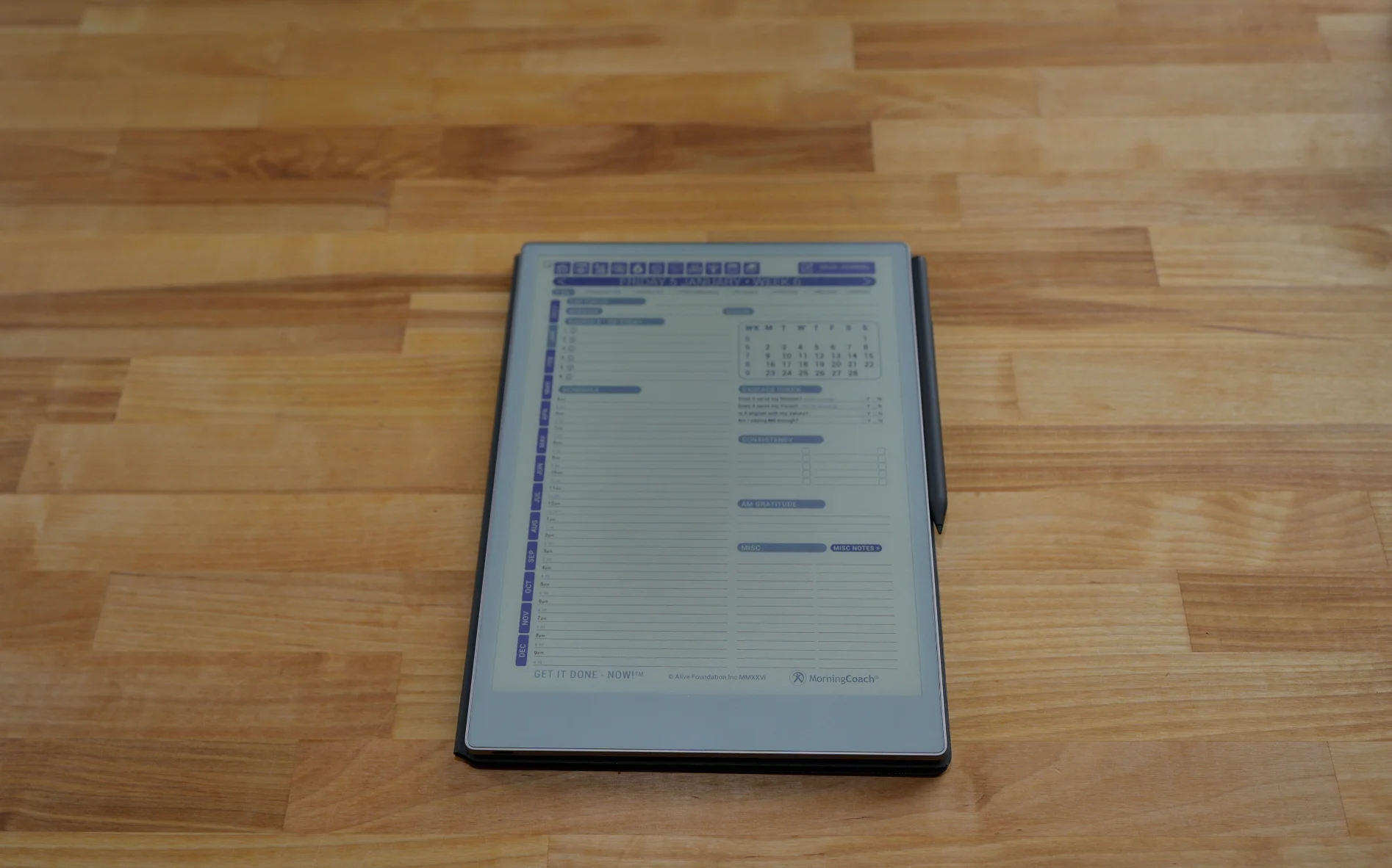 Get It Done — NOW! for reMarkable planner beside a coffee cup
