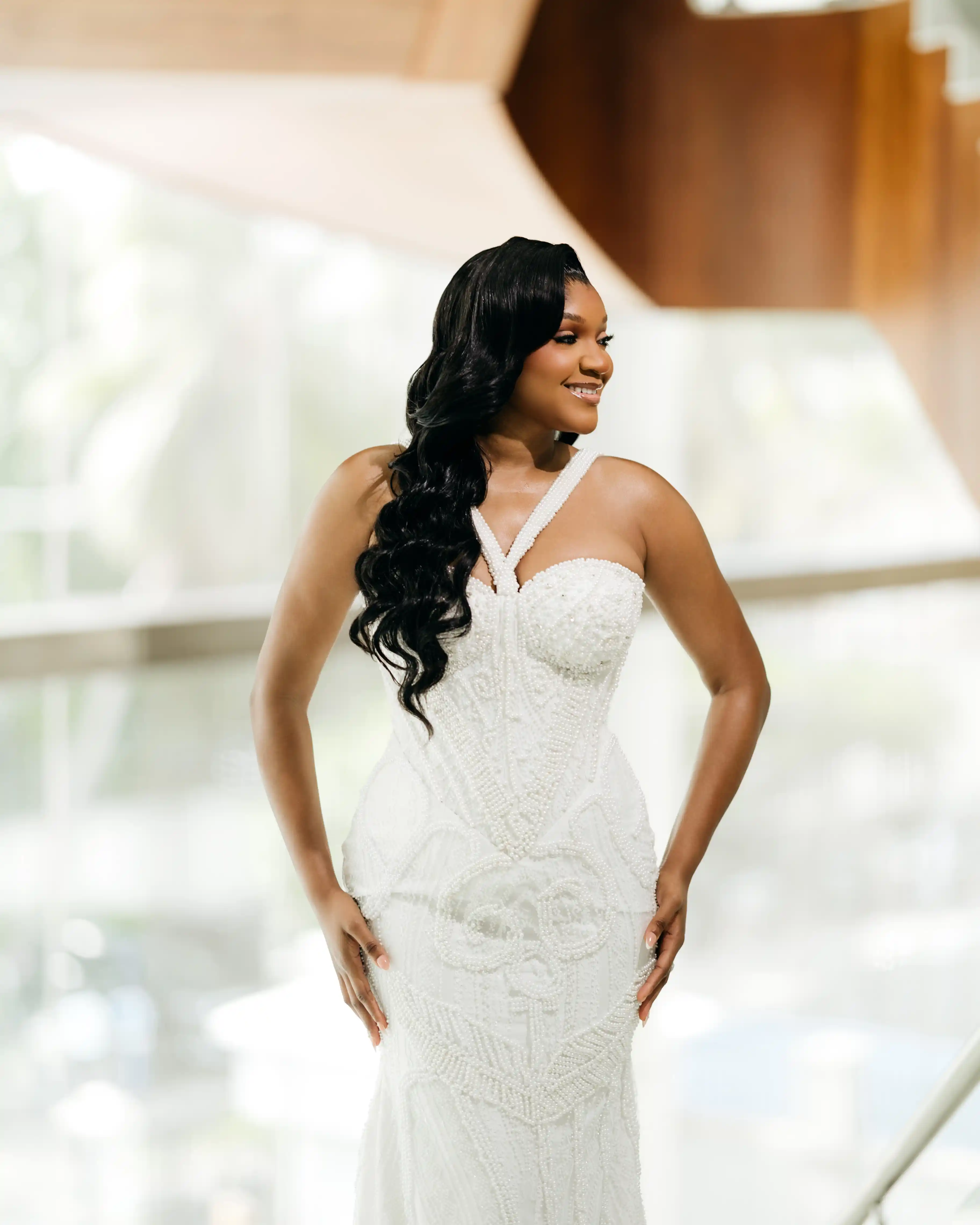 Beautiful bride holding a bouquet before the wedding ceremony.