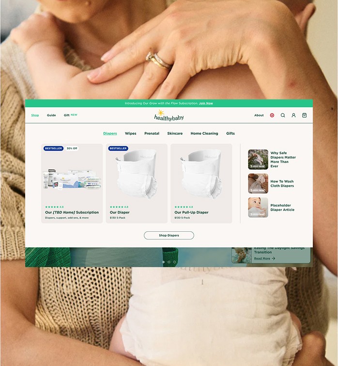 Trains at a station with sun shining through roof.