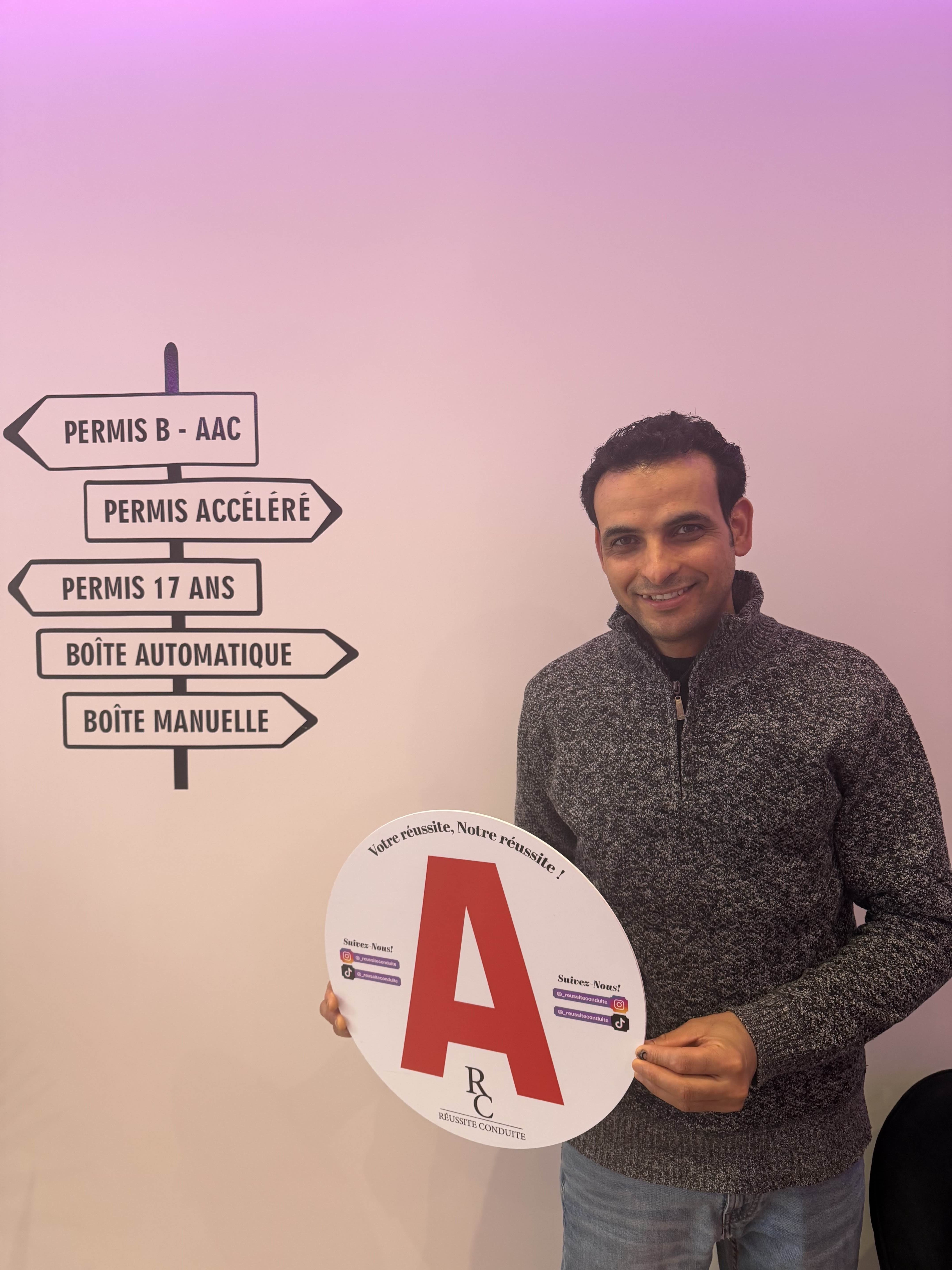 man in black jacket holding blue tablet computer