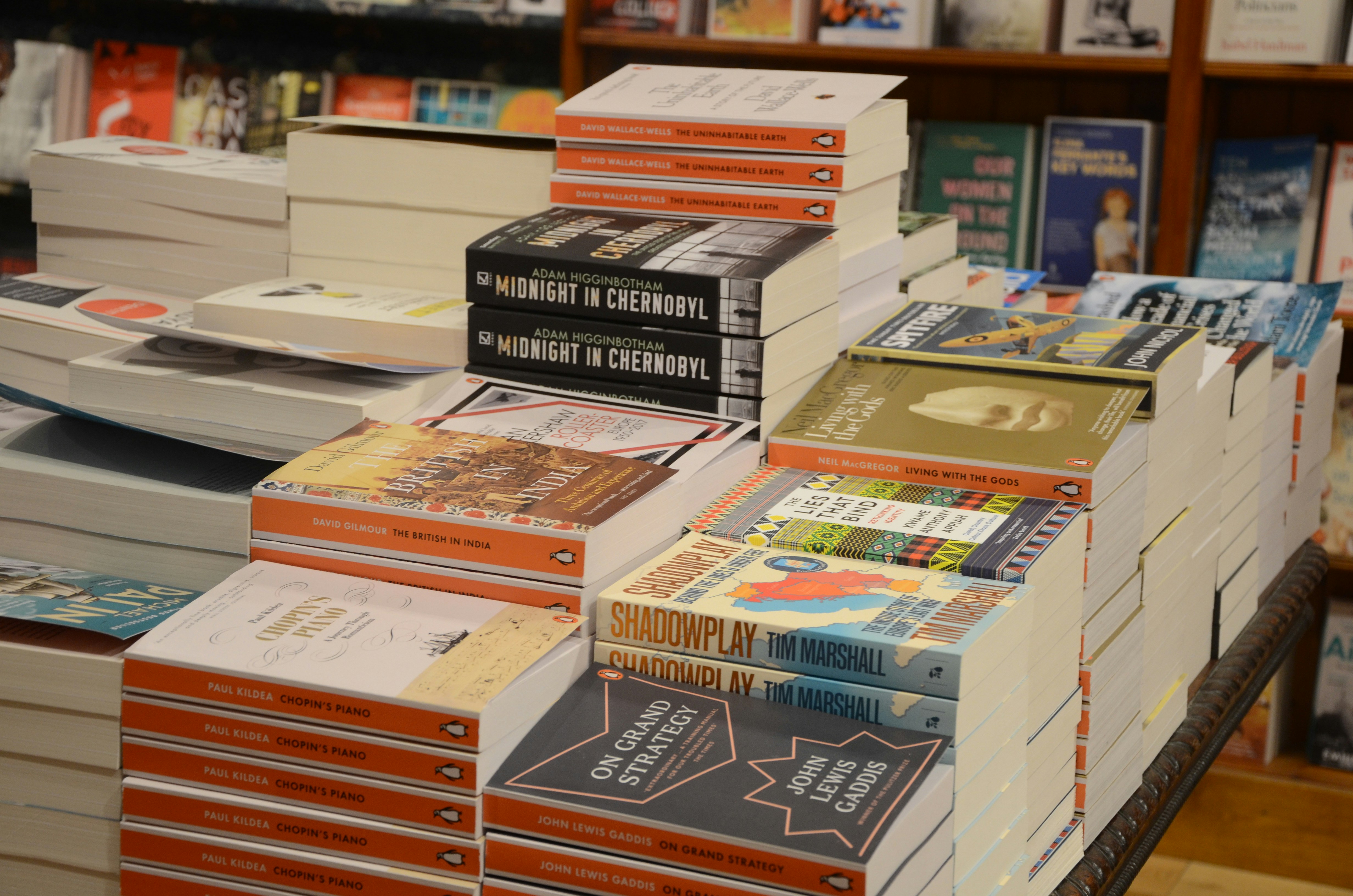 piles of books in a book store