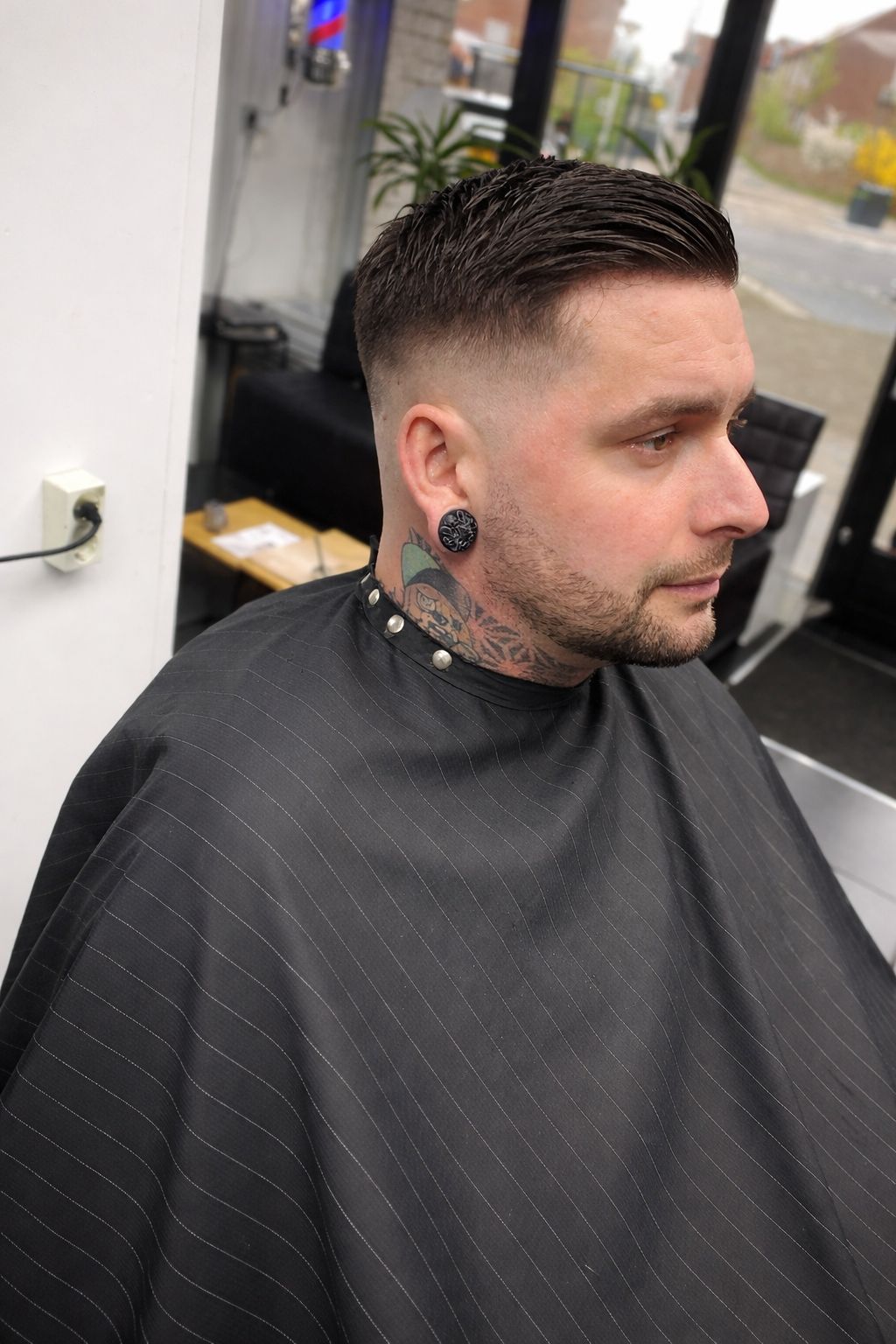 Barber attending client