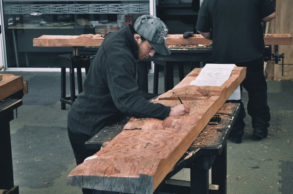 Carpenter inscribing on wood