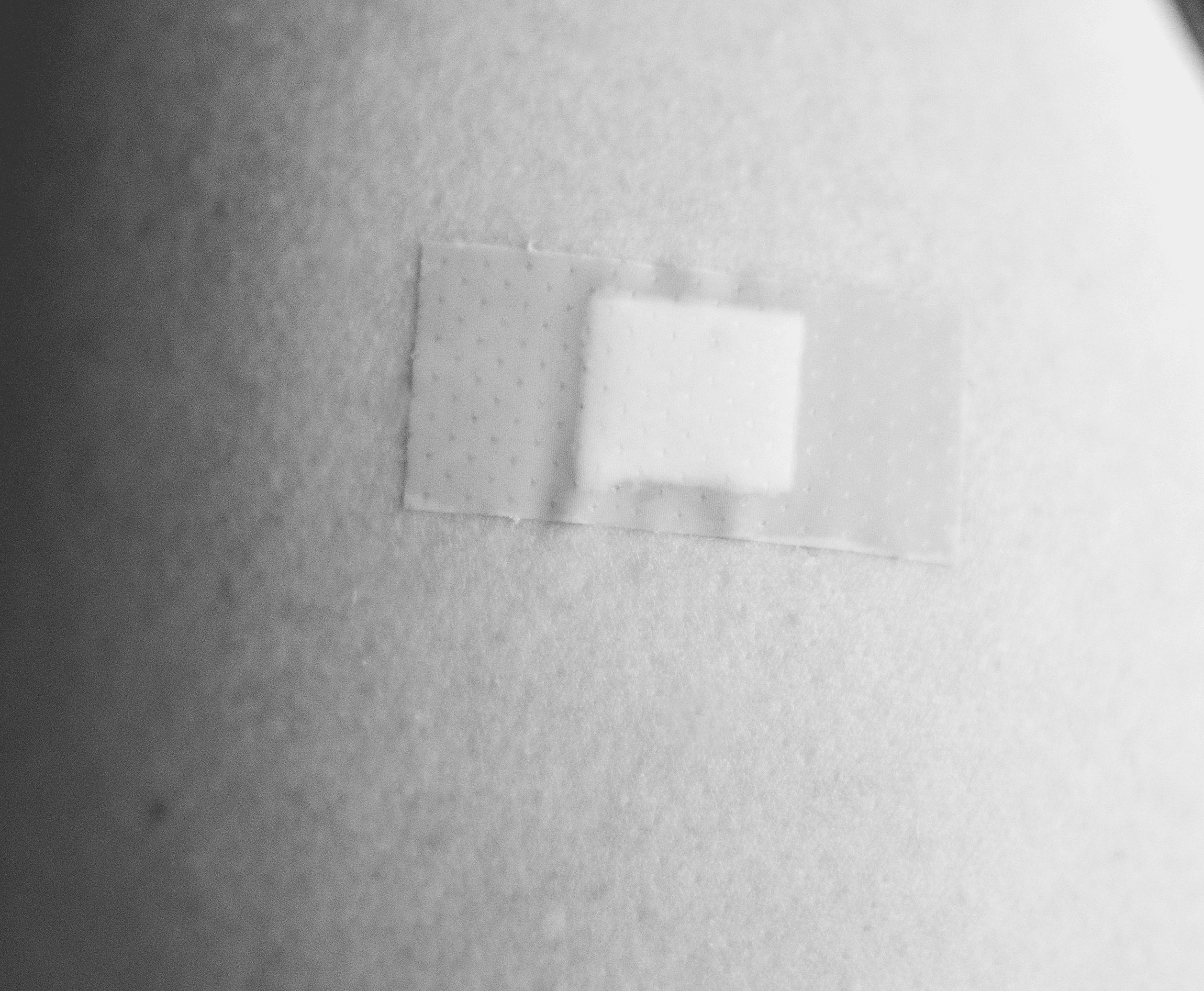 grayscale photo of woman in tank top