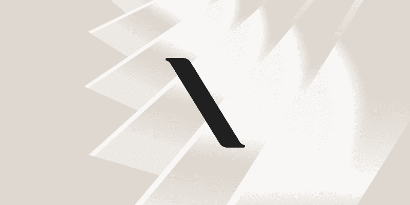 Close-up of lush, dark green leaves, some glossy and wet, against a muted background.