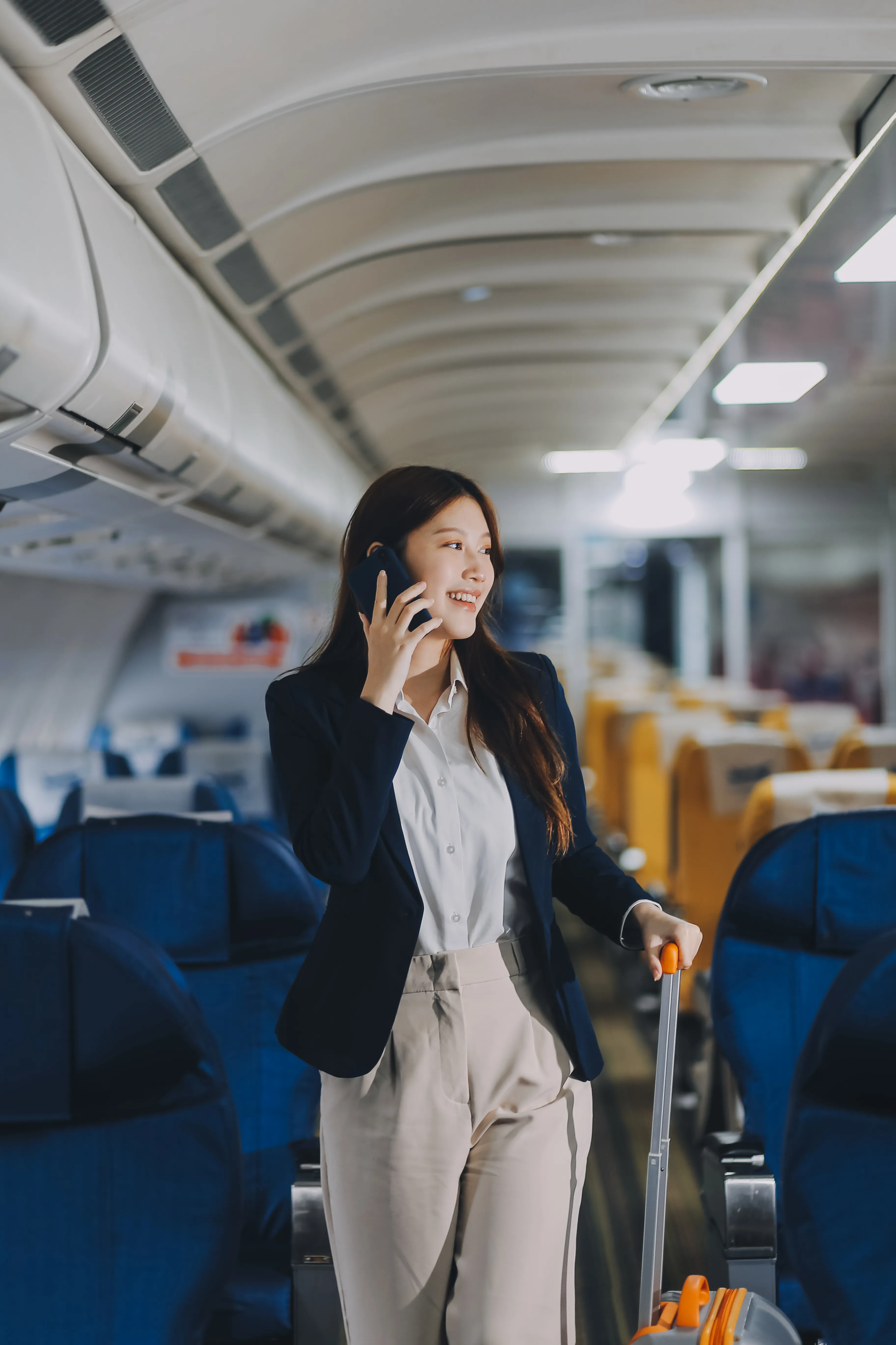 Young asian woman on business trip in the airplane