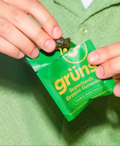 Hand grabbing gummy from package