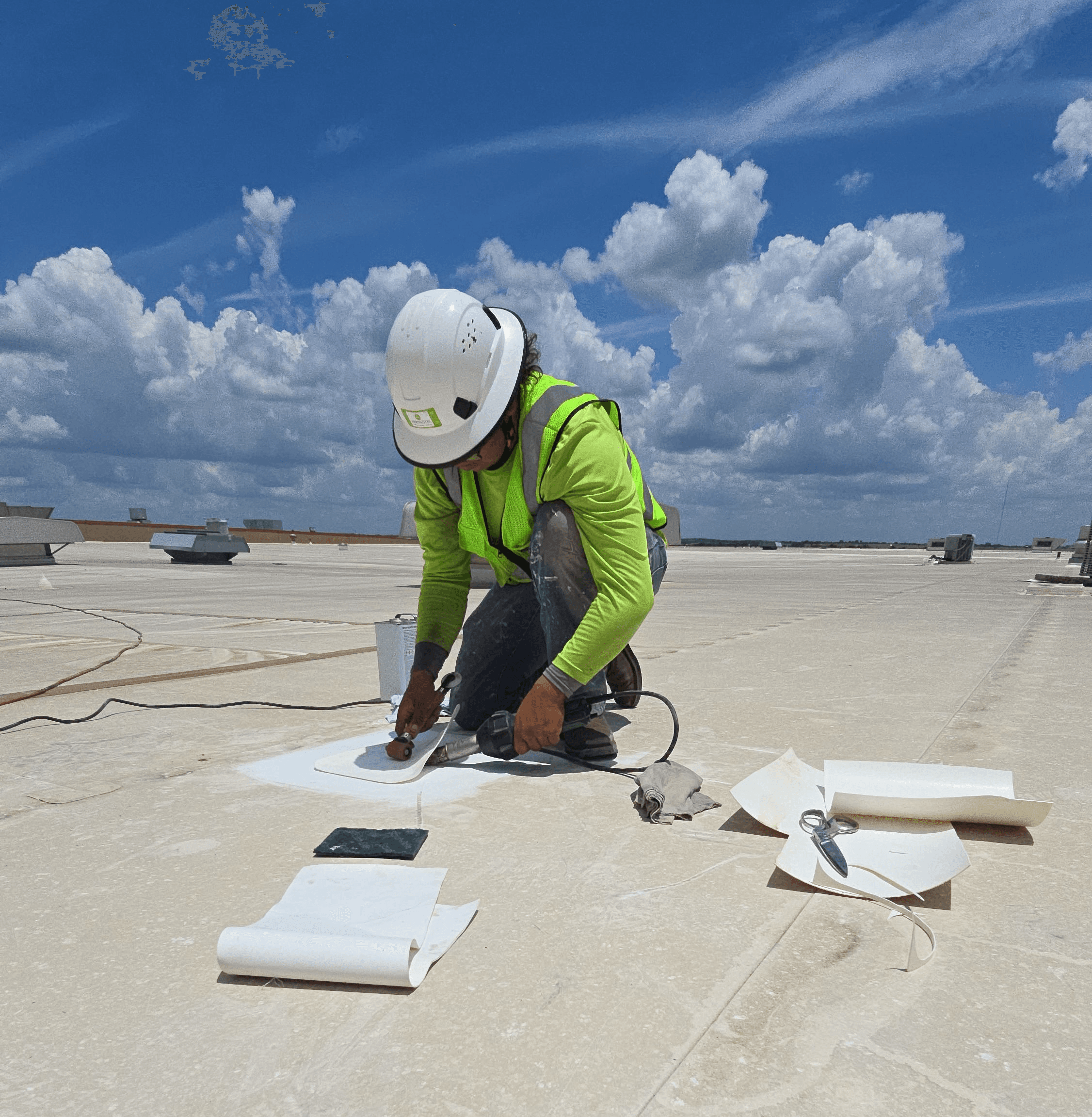 Arrington Roofing crew heat-welding a TPO membrane seam during a commercial roof repair in Dallas