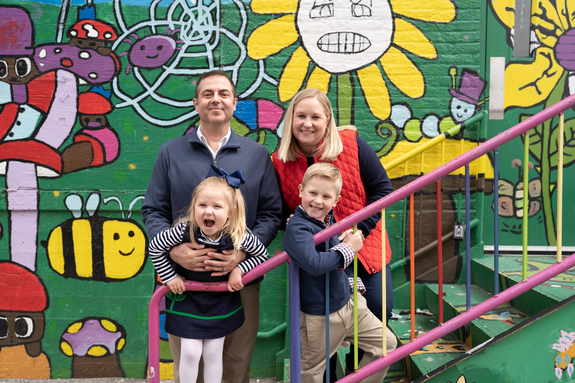The Abshire family of four posing together 