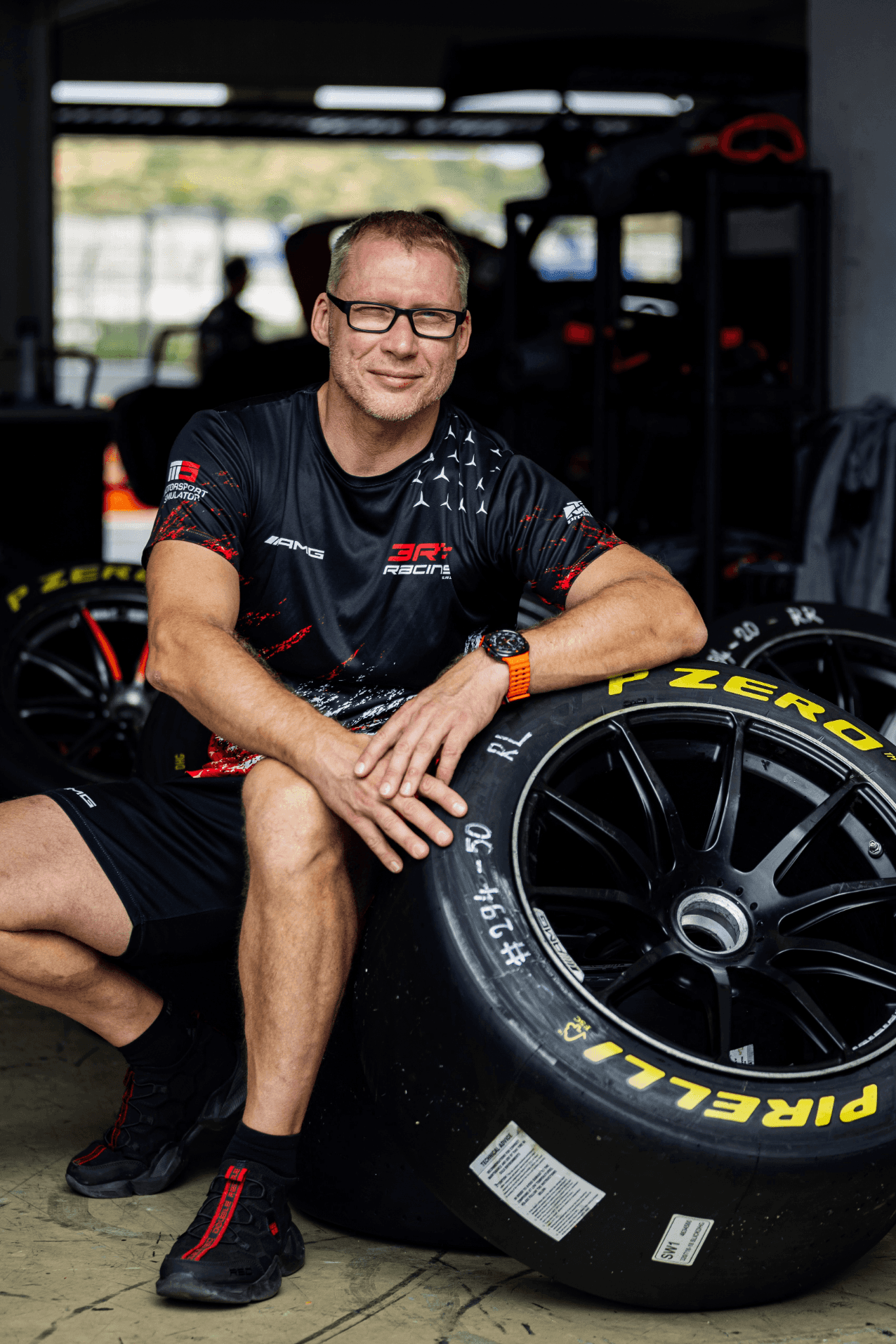 Petr Lisa leaning on racing tire