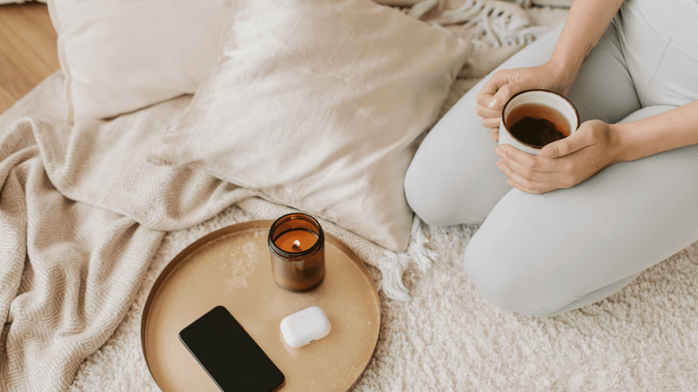 Young woman running through a grassy field