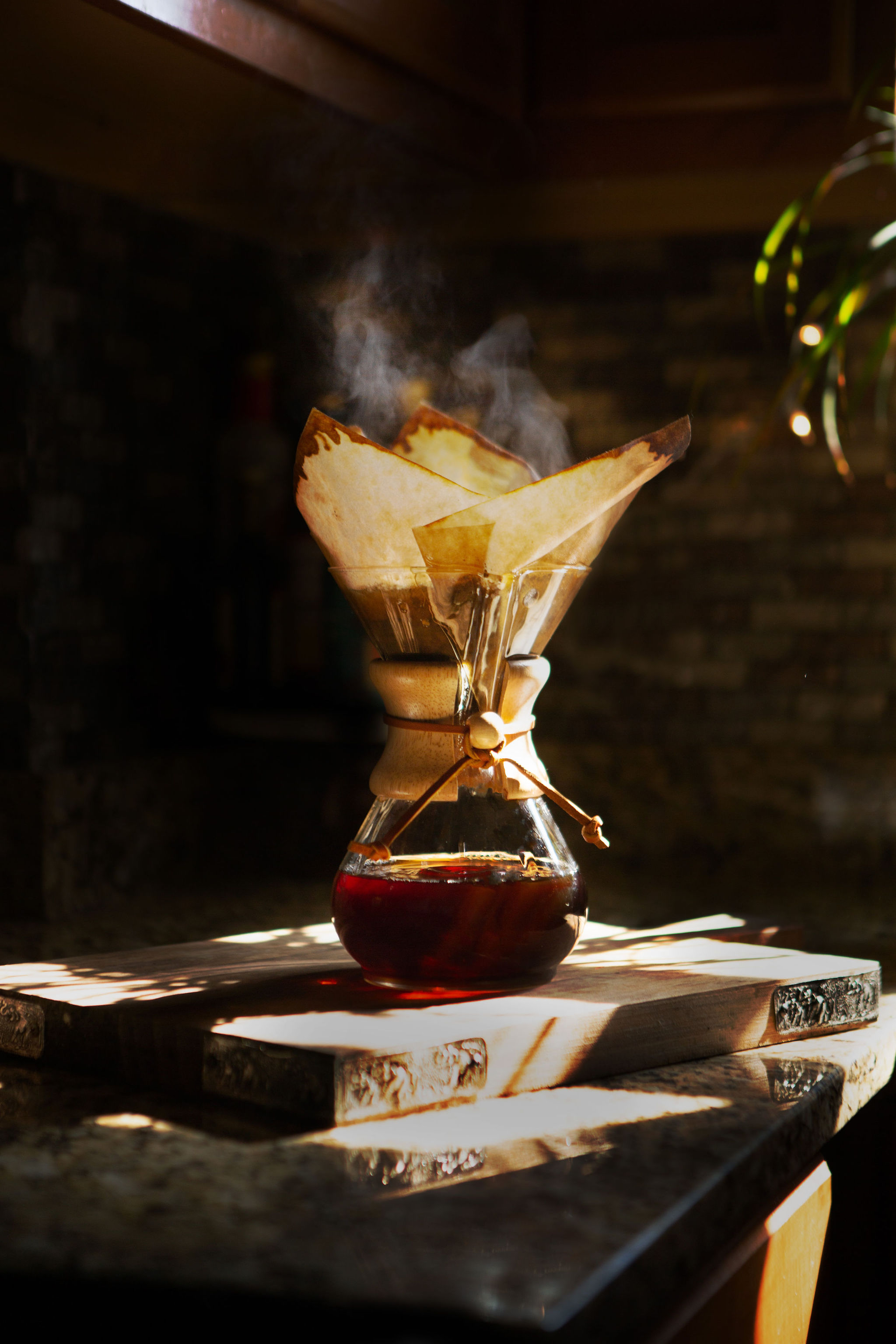 Sunlight streams through an arched window onto a ledge.