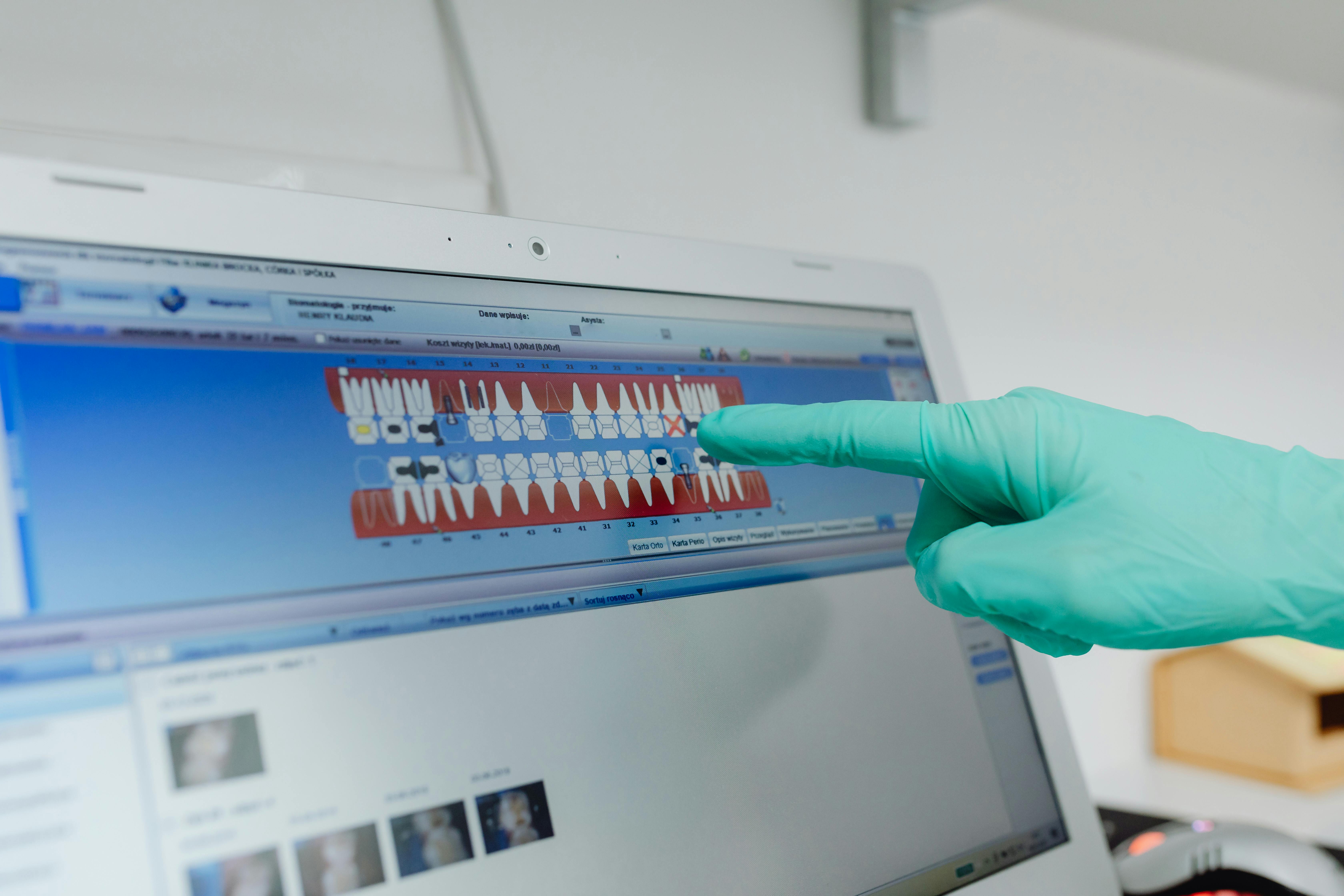 dentist looking at dentistry software